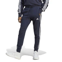 ADIDAS Essentials French Terry Tapered Cuff 3-Stripes Pantalone Da Allenamento Uomini - Blu Scuro, Bianco